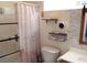 Modern bathroom featuring a shower with glass doors, decorative shelves and tiles at 132 Hammond Dr, Canton, GA 30114