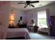 A decorated bedroom featuring playful decor, a large window, and soft, neutral colors at 132 Hammond Dr, Canton, GA 30114