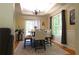 Elegant dining room with hardwood floors, tray ceiling, and large window letting in natural light at 132 Hammond Dr, Canton, GA 30114