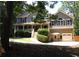 Charming two-story home featuring a welcoming front porch and a well-maintained landscaped yard at 132 Hammond Dr, Canton, GA 30114