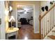 A view of the entry foyer, showcasing the hardwood floors and staircase leading to the upper level at 132 Hammond Dr, Canton, GA 30114