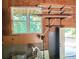 Garage with a large window, door to the backyard and shelves filled with wood at 132 Hammond Dr, Canton, GA 30114