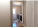 Bright laundry room featuring modern washer and dryer with direct access to the outdoors at 132 Hammond Dr, Canton, GA 30114