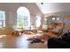 Bright living room featuring vaulted ceilings, large windows, and hardwood floors at 132 Hammond Dr, Canton, GA 30114