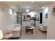 Modern living room with recessed lighting, white walls and furniture, with stainless steel appliances at 132 Hammond Dr, Canton, GA 30114