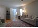 Cozy living room featuring plush sofas, a decorative rug, and plenty of natural light at 132 Hammond Dr, Canton, GA 30114