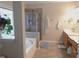 Bright main bathroom featuring a separate shower and soaking tub with dual sink vanity at 132 Hammond Dr, Canton, GA 30114