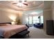 Bright main bedroom featuring a tray ceiling, sitting area, and plush carpet at 132 Hammond Dr, Canton, GA 30114