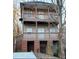 Charming multi-level exterior featuring a spacious porch on each level and sturdy brick foundation at 1470 Andrews Nw St, Atlanta, GA 30314