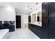 Luxury bathroom with a freestanding tub, glass shower, double vanity with gold accents, and marble floors at 1798 Braselton Hwy, Lawrenceville, GA 30043