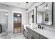 Bathroom with double sink vanity, marble floors, and glass shower at 1798 Braselton Hwy, Lawrenceville, GA 30043