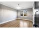 Bedroom with hardwood floors and a modern chandelier fixture at 1798 Braselton Hwy, Lawrenceville, GA 30043