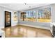 Bright dining area with large windows showcasing backyard views and modern lighting at 1798 Braselton Hwy, Lawrenceville, GA 30043