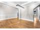 A bright dining room featuring hardwood floors and a modern chandelier hanging from the decorative ceiling at 1798 Braselton Hwy, Lawrenceville, GA 30043