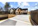 Expansive two-story home with manicured landscaping and a secure gated entrance on a sprawling lot at 1798 Braselton Hwy, Lawrenceville, GA 30043