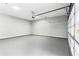 Spacious three-car garage with an automatic door and freshly epoxied floors at 1798 Braselton Hwy, Lawrenceville, GA 30043