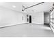 Spacious three-car garage with an automatic door and freshly epoxied floors at 1798 Braselton Hwy, Lawrenceville, GA 30043