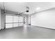 Spacious garage with epoxy floors and modern door with translucent panels at 1798 Braselton Hwy, Lawrenceville, GA 30043