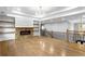 Open-concept living room with hardwood floors, fireplace, and railings at 1798 Braselton Hwy, Lawrenceville, GA 30043