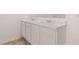 Bathroom features a double sink vanity with marble countertops at 8590 Secretariat Dr, Lithonia, GA 30058