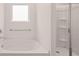 Bathroom with a tub and separate shower stall at 8590 Secretariat Dr, Lithonia, GA 30058