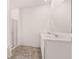 Bathroom features a double sink vanity with marble countertops and a glass-enclosed shower at 8590 Secretariat Dr, Lithonia, GA 30058