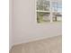Bedroom with a large window and carpet floors at 8590 Secretariat Dr, Lithonia, GA 30058