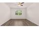 Bright bedroom boasting hardwood floors and large windows to allow in natural light at 8590 Secretariat Dr, Lithonia, GA 30058