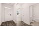 Welcoming entryway showcasing a well-lit foyer and adjacent bathroom at 8590 Secretariat Dr, Lithonia, GA 30058