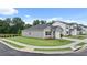 Attractive one-story home with a manicured lawn in a suburban setting, featuring a two-car garage at 8590 Secretariat Dr, Lithonia, GA 30058