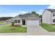 Charming one-story home showcasing a well-manicured lawn and a two-car garage, embodying suburban comfort at 8590 Secretariat Dr, Lithonia, GA 30058