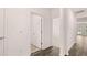 Hallway showcasing a doorway with a view to a living room, and hardwood flooring at 8590 Secretariat Dr, Lithonia, GA 30058