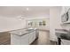 Bright, modern kitchen with a center island, stainless steel appliances, and an open layout at 8590 Secretariat Dr, Lithonia, GA 30058