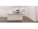 Modern kitchen features granite counters, stainless appliances, and white cabinetry at 8590 Secretariat Dr, Lithonia, GA 30058