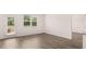 Open-concept living area with wood flooring and access to the backyard at 8590 Secretariat Dr, Lithonia, GA 30058