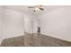 Bright living room featuring hardwood floors and an open concept layout to the kitchen at 8590 Secretariat Dr, Lithonia, GA 30058