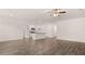 Spacious living room featuring an open layout to the kitchen with an island and modern finishes at 8590 Secretariat Dr, Lithonia, GA 30058