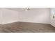 Well-lit living room with ceiling fan, modern floors, and neutral paint at 8590 Secretariat Dr, Lithonia, GA 30058