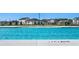 Bright and sunny day at the community pool with depth markers clearly visible, surrounded by homes and trees at 8590 Secretariat Dr, Lithonia, GA 30058