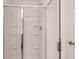 Clean white shower with three built-in shelves at 8590 Secretariat Dr, Lithonia, GA 30058