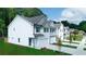 A line of gorgeous townhomes each featuring a single-car garage, a manicured lawn, and verdant trees at 4285 Notting Hill Dr # 65, Atlanta, GA 30331
