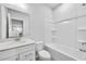 Bright bathroom with a vanity, toilet, and tub/shower combination at 6096 Marigold Way, Atlanta, GA 30349