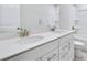 Bathroom has a double vanity with white cabinets and chrome fixtures at 6096 Marigold Way, Atlanta, GA 30349