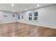 Spacious, well-lit living area with hardwood floors and neutral paint at 6096 Marigold Way, Atlanta, GA 30349