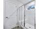 Bathroom has a tiled shower with glass doors and a shower seat at 6096 Marigold Way, Atlanta, GA 30349