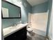 Bathroom with a modern vanity, updated fixtures, and a shower-tub combination at 1004 Hamilton Dr, Locust Grove, GA 30248