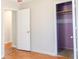 Bedroom with hardwood flooring and a closet with an open door at 1004 Hamilton Dr, Locust Grove, GA 30248