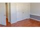 Bedroom with laminate wood flooring and double door closet at 1004 Hamilton Dr, Locust Grove, GA 30248