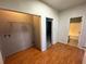 Laundry room with laminate wood flooring and hookups at 1004 Hamilton Dr, Locust Grove, GA 30248