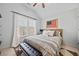 Charming bedroom featuring an American flag decor, bench, and natural light at 203 Hubbard Rd, Woodstock, GA 30188